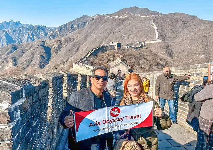 Clientes de AOT caminando por la Gran Muralla de Mutianyu